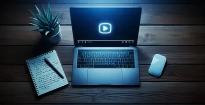 Dodawanie tekstu do wideo za pomocą KineMaster scena przedstawia laptopa z ikoną odtwarzania na notebooku