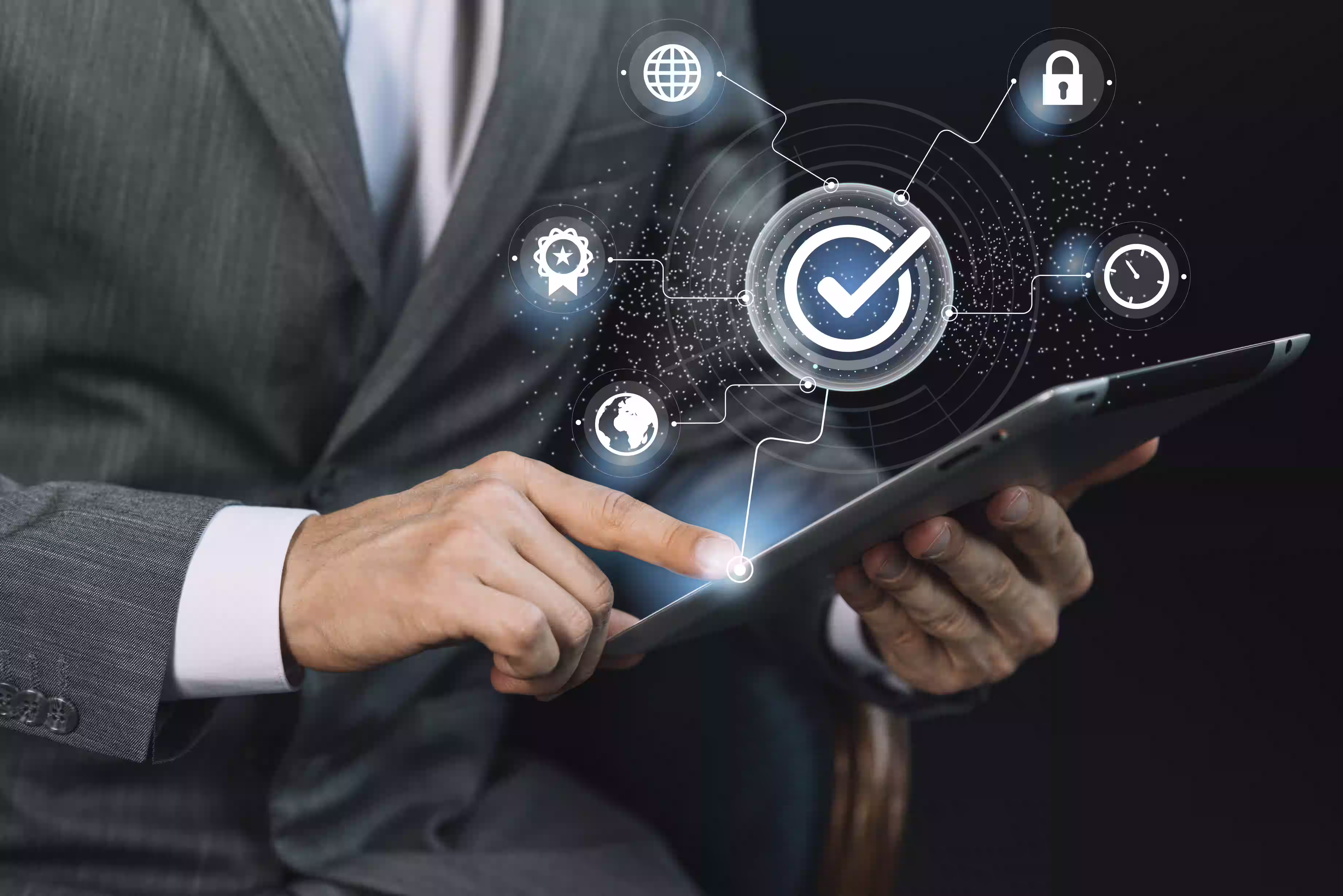 Business professional using tablet with digital compliance and verification icons floating above