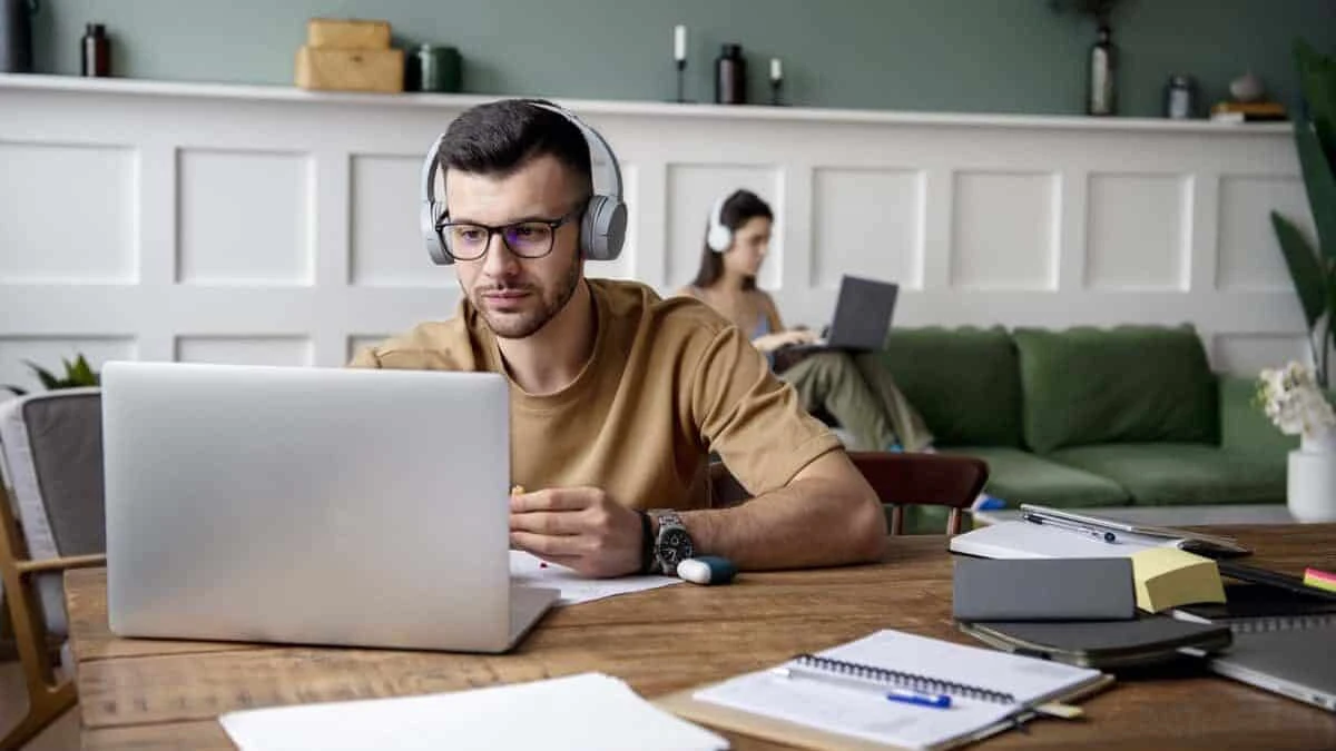 man watching a video on his laptop