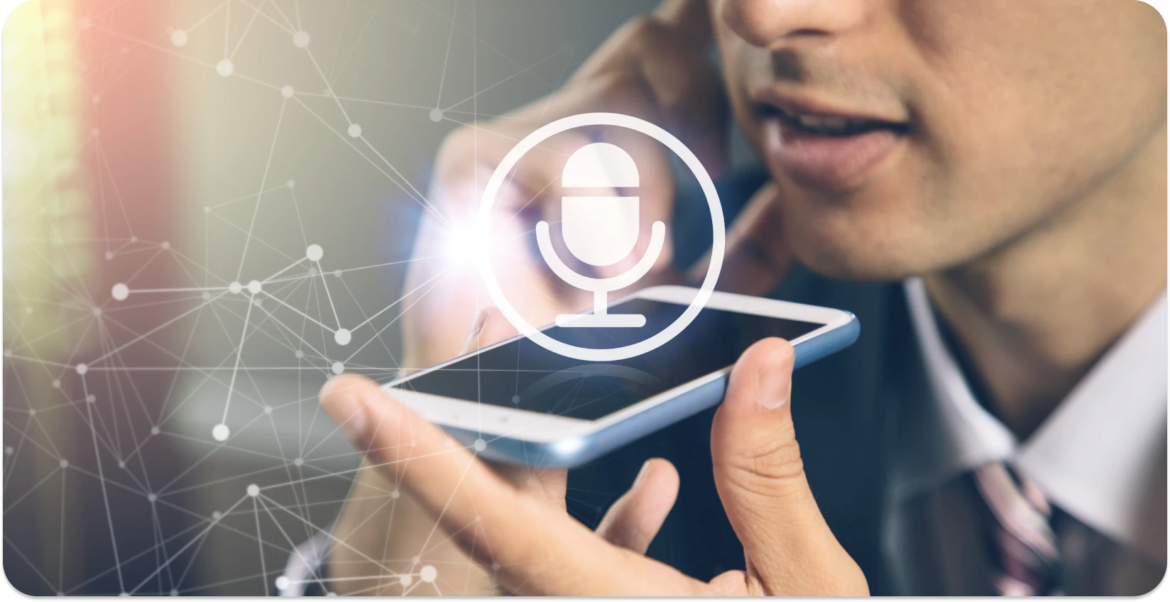 Geschäftsmann mit einer Diktier-App auf seinem Smartphone, mit einem digitalen Mikrofonsymbol, das die Spracheingabe symbolisiert.