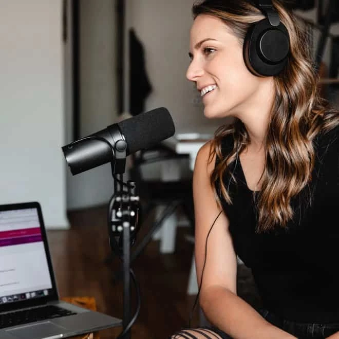a woman talking for a podcast